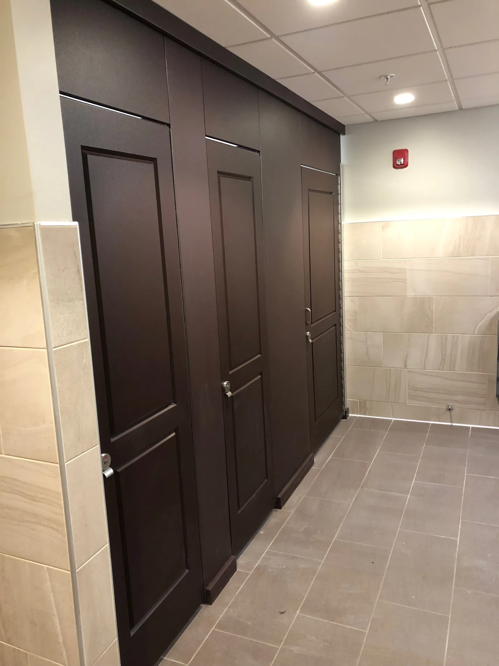 Installed commercial restroom toilet partitions by Hostetter Supply.