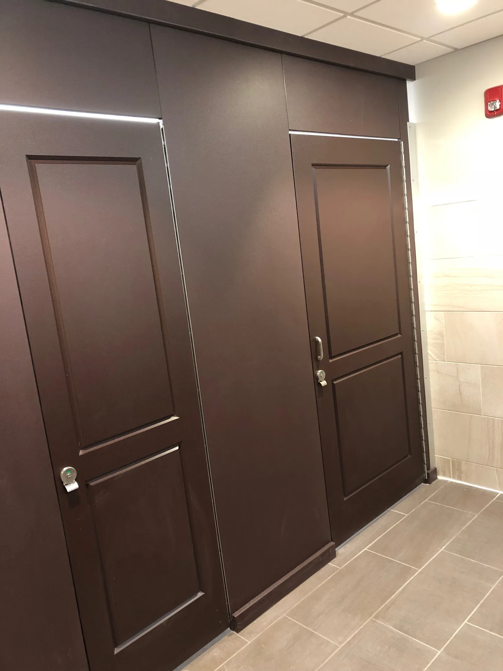 Restroom partition installation showing commercial stalls.